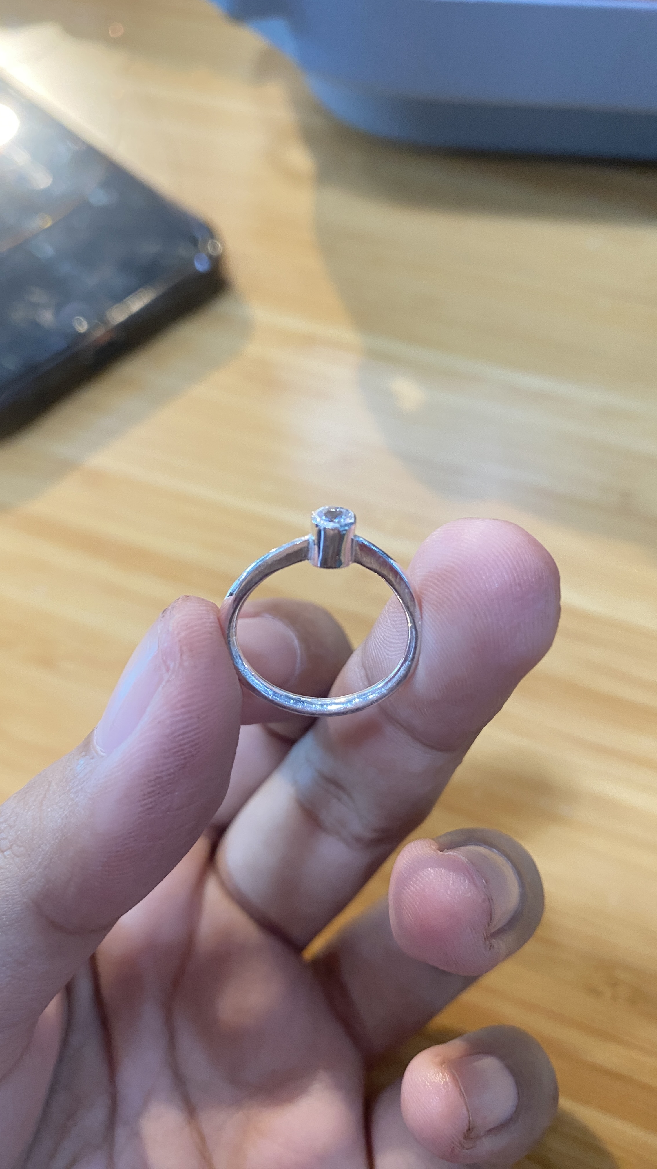 Finished ring held in fingers