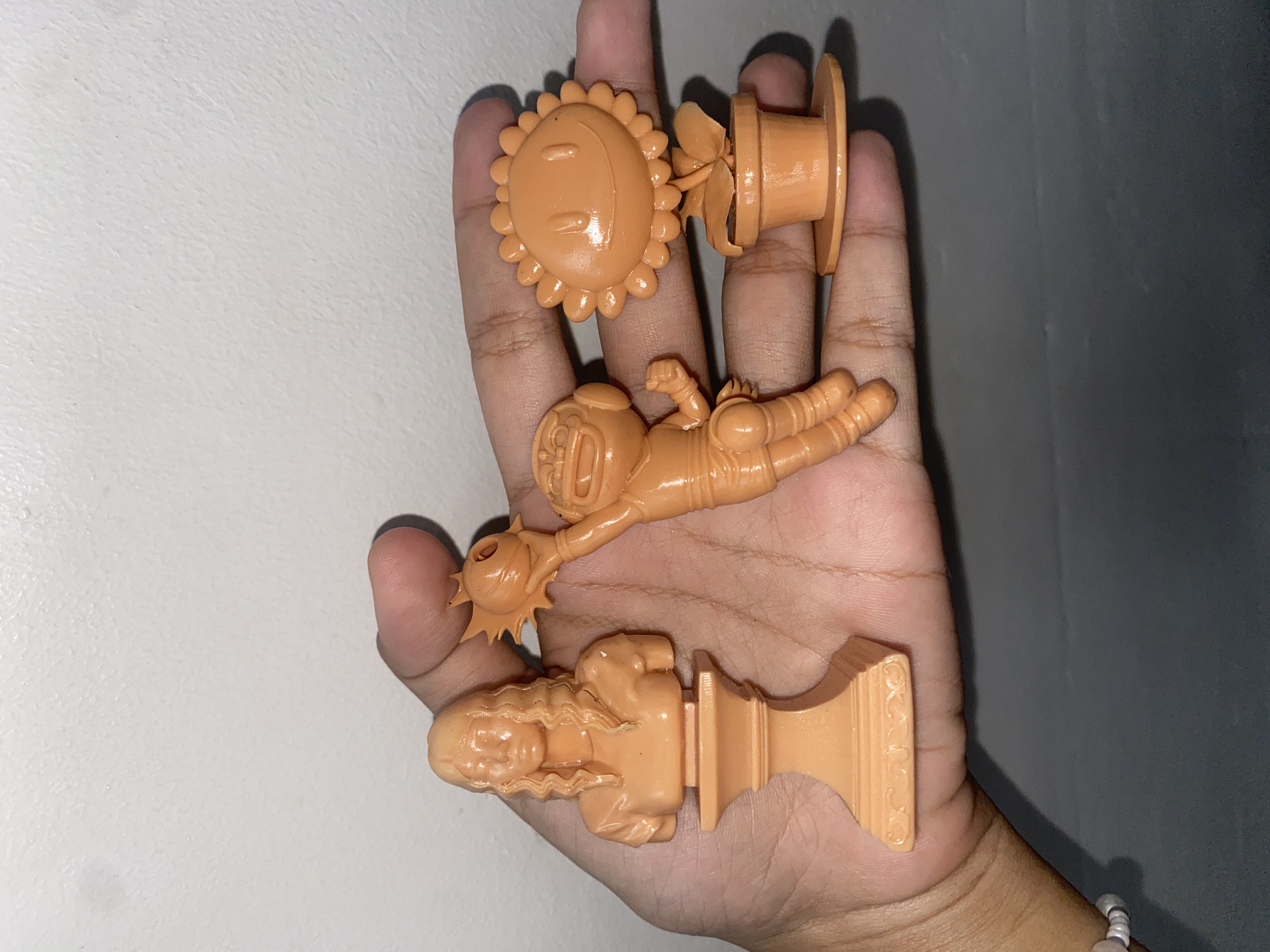Hand holding 3D printed pieces